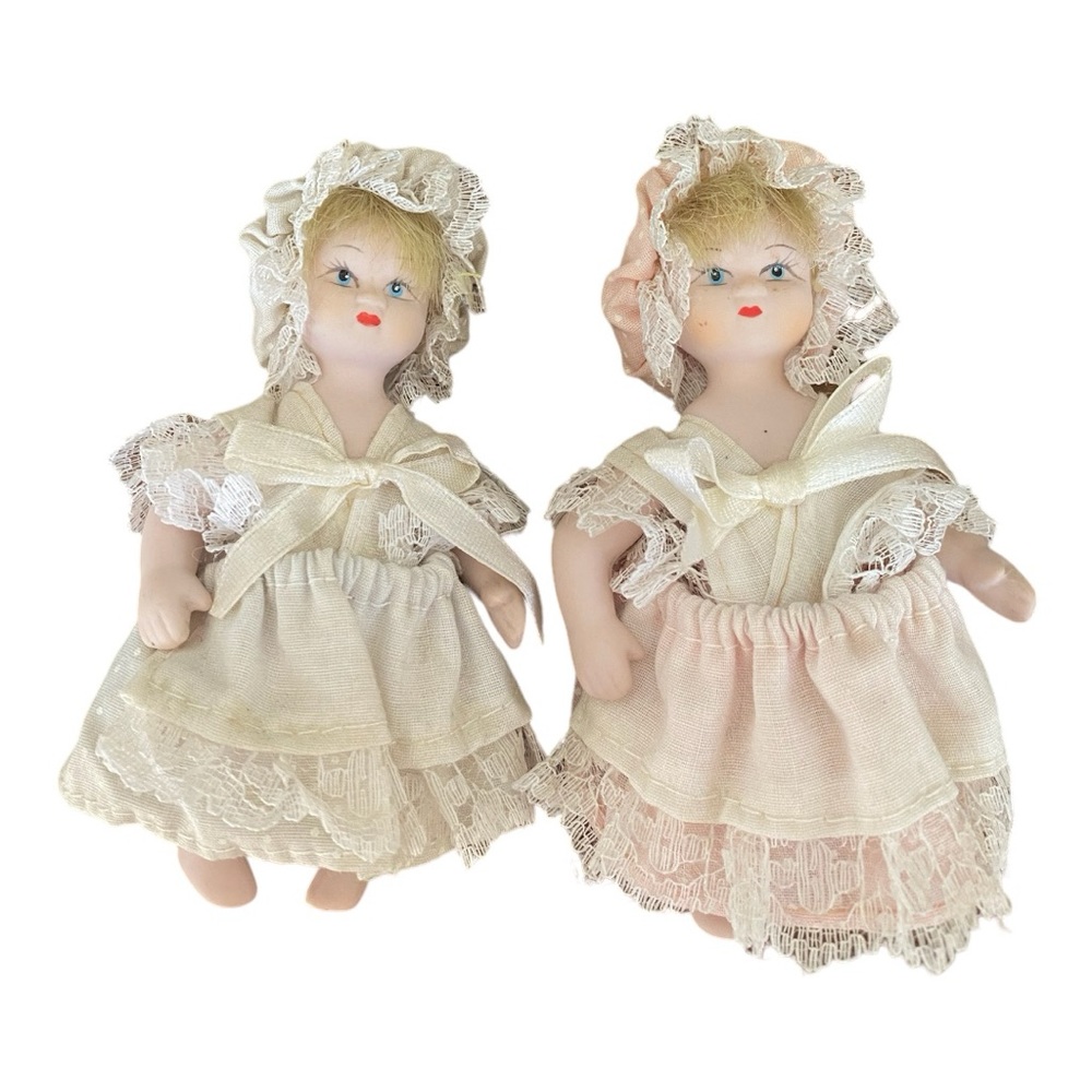Vintage porcelain dolls with handmade clothing